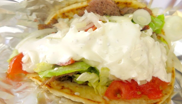 The story of Greek Gyro King goes back to 1969, when Chris Menexas was already helping shape New York’s early gyro scene — long before gyros became a citywide staple. Even back then, the small operation caught the attention of The New York Times, which highlighted its authentic approach. At the time, the focus wasn’t trends or reinvention. It was about doing things the right way: properly seasoned meat, warm pita, and flavors rooted in Greek tradition.